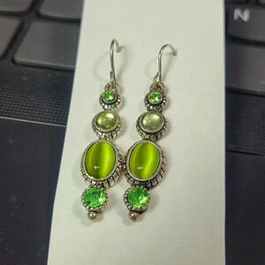 Vintage silver tone avocado green cat eye (moon glow?) Rhinestone earrings